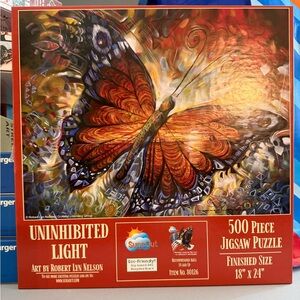 SunsOut Uninhibited Light 500 Piece Jigsaw Puzzle - Red and Orange Butterfly
